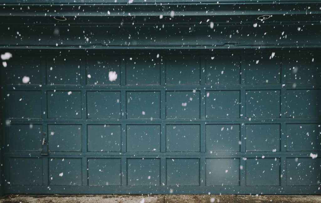 snow falling in front of garage door