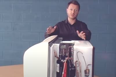 man standing next to HVAC equipment